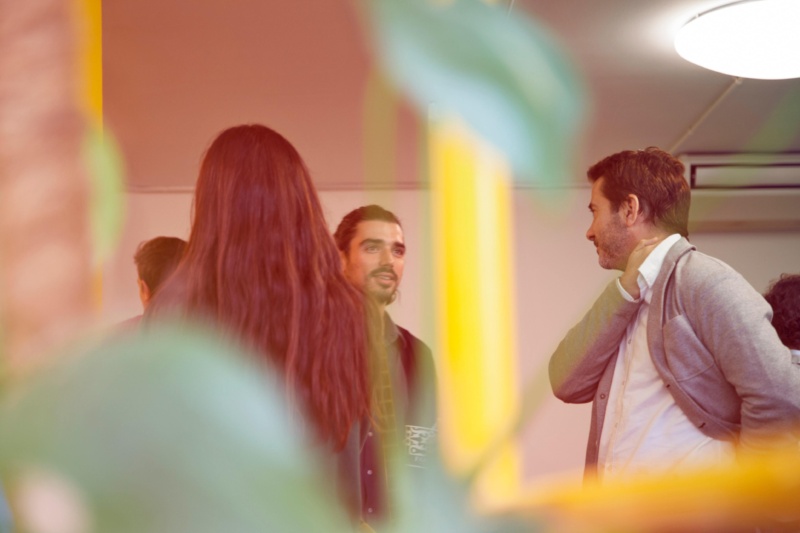 Mix of individuals stood around talking at a TV industry meet-up